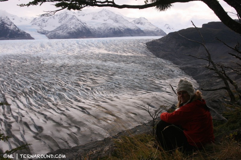 Admiring the view high above Grey glacier on the Circuito trail (Torres del Paine, Patagonia)